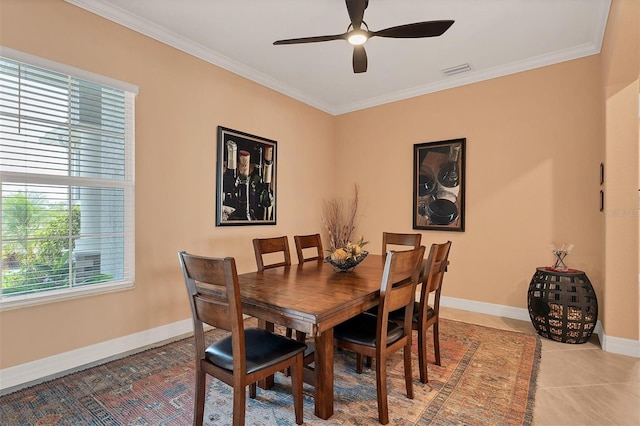 dining area featuring ornamental molding, ceiling fan, and light tile patterned flooring