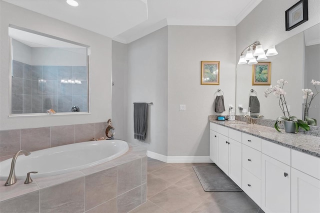 bathroom with tile patterned flooring, ornamental molding, a relaxing tiled tub, and vanity