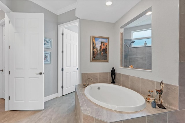 bathroom with separate shower and tub, ornamental molding, and tile patterned floors