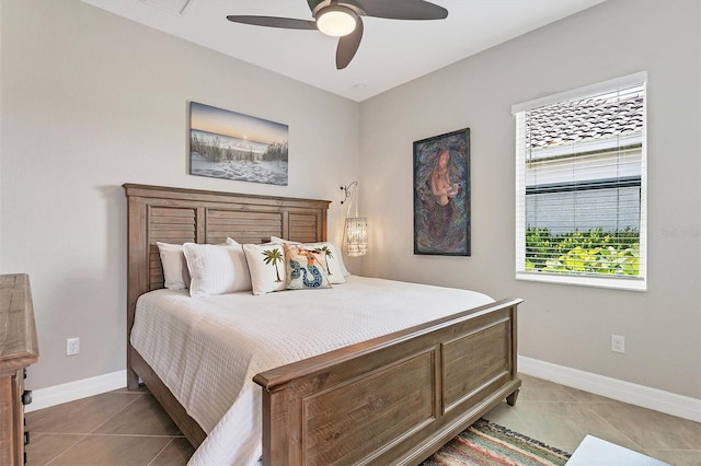 bedroom featuring ceiling fan and light tile patterned flooring