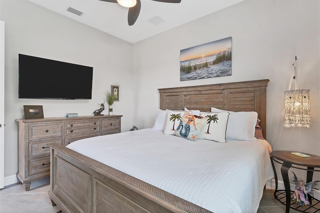 bedroom with ceiling fan and light tile patterned floors