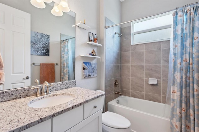 full bathroom featuring shower / tub combo with curtain, vanity, and toilet