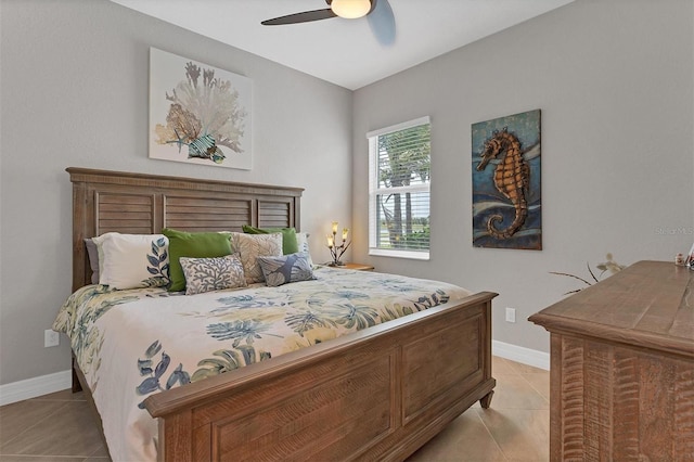 bedroom with ceiling fan and light tile patterned floors