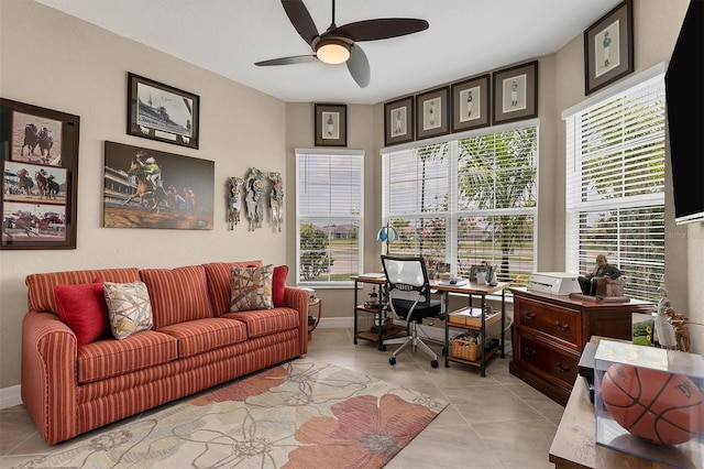 office area with light tile patterned flooring and ceiling fan