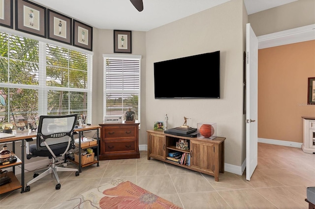 tiled office space with ceiling fan