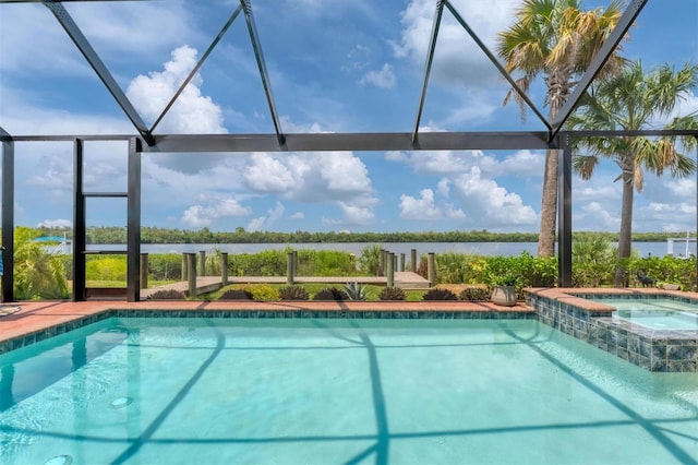 view of swimming pool with a water view, glass enclosure, and an in ground hot tub