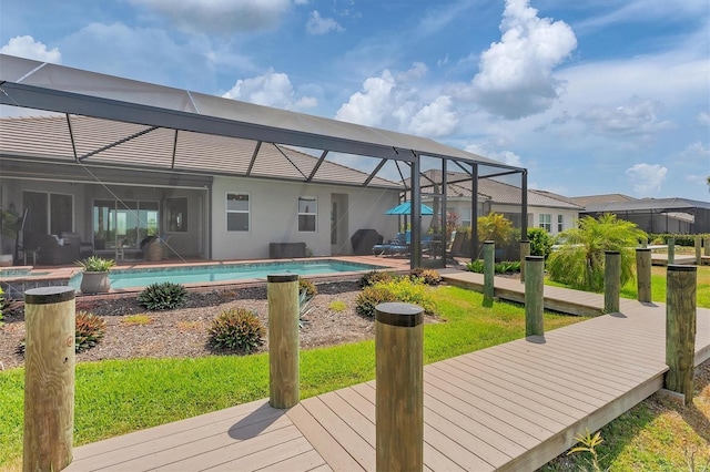 view of pool with a patio and a lanai