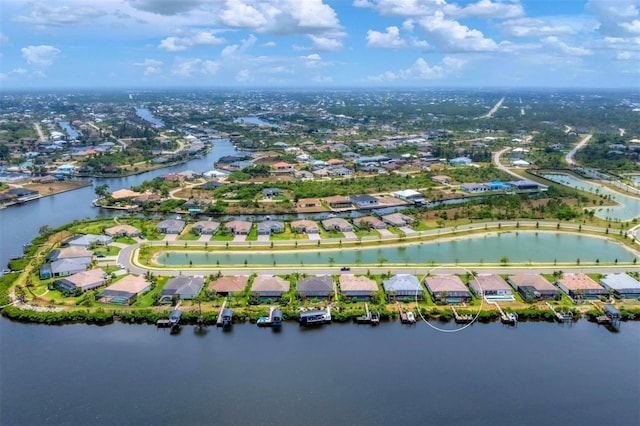 drone / aerial view with a water view