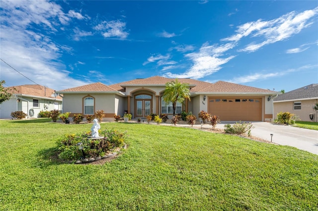 mediterranean / spanish-style home with a front yard and a garage