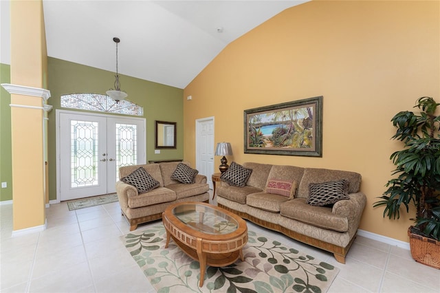 240 White Marsh Ln, Rotonda West, FL 33947 - living area featuring light tile patterned floors, french doors, baseboards, and high vaulted ceiling