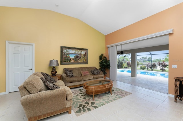 240 White Marsh Ln, Rotonda West, FL 33947 - living room with tile patterned flooring, a sunroom, baseboards, and high vaulted ceiling