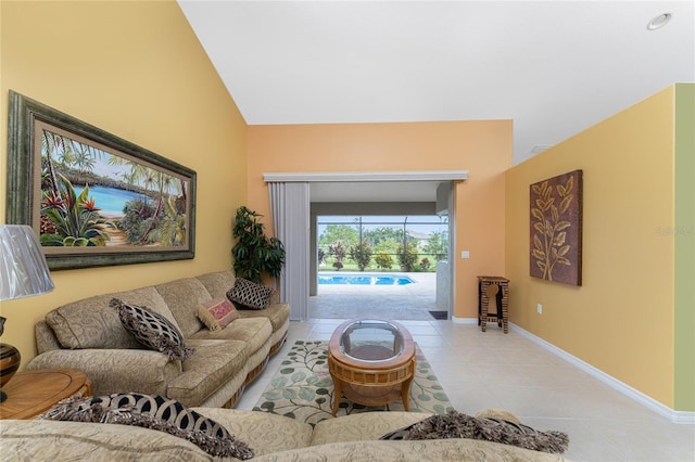 living room featuring light tile patterned floors and vaulted ceiling