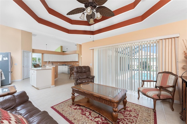 240 White Marsh Ln, Rotonda West, FL 33947 - living area featuring a ceiling fan, baseboards, light tile patterned flooring, and a high ceiling