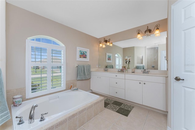 bathroom featuring vanity, independent shower and bath, and tile patterned floors