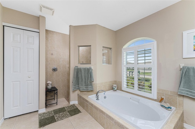 bathroom with tile patterned floors and separate shower and tub