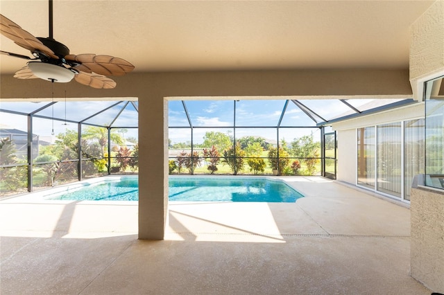 view of pool featuring a patio, ceiling fan, and a lanai