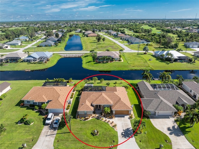 birds eye view of property with a water view