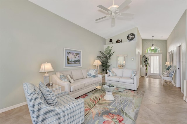 living room with high vaulted ceiling, ceiling fan, and light tile patterned floors