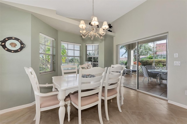 dining room featuring a healthy amount of sunlight, tile patterned flooring, and a chandelier