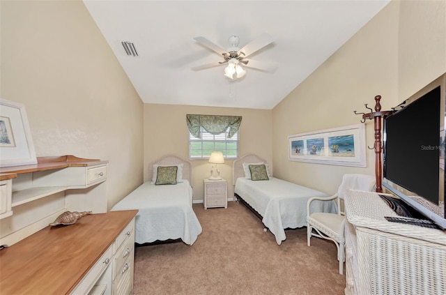 carpeted bedroom with ceiling fan and vaulted ceiling