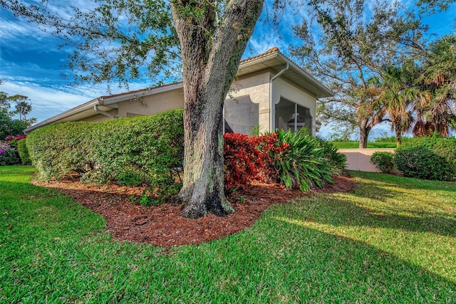 view of home's exterior featuring a lawn