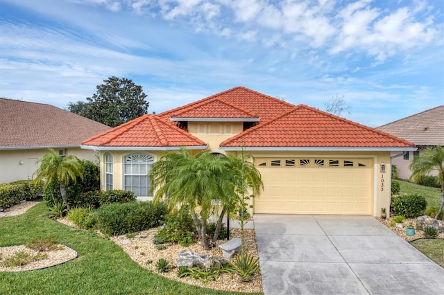 mediterranean / spanish home featuring a front yard and a garage