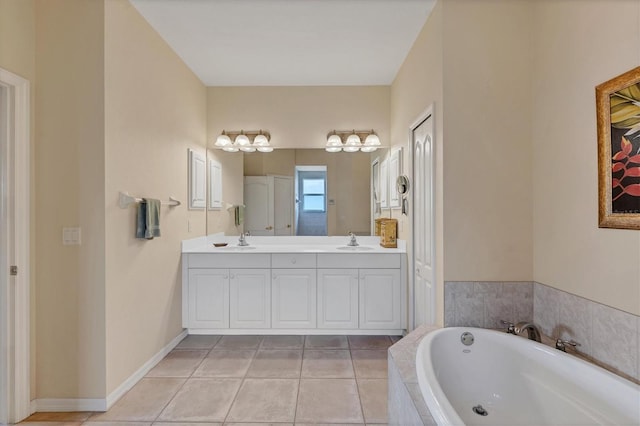 bathroom with vanity, tile patterned floors, and tiled tub