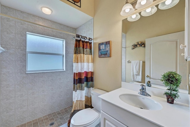 bathroom with toilet, vanity, and a shower with shower curtain