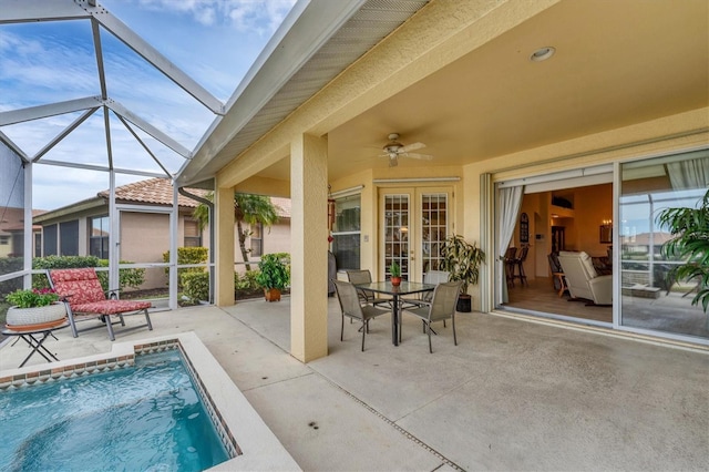 view of pool featuring a patio, a lanai, and ceiling fan