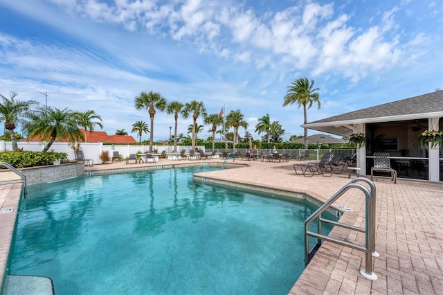 view of swimming pool with a patio area