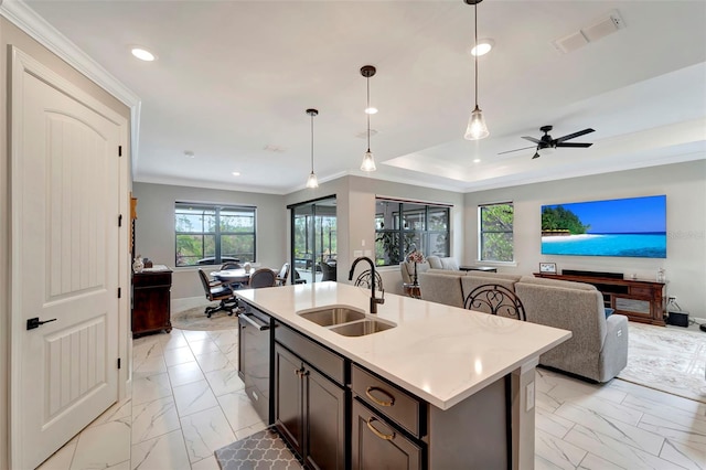 kitchen with sink, black dishwasher, light stone countertops, an island with sink, and decorative light fixtures