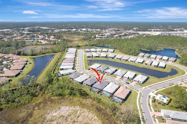 aerial view with a water view and a residential view