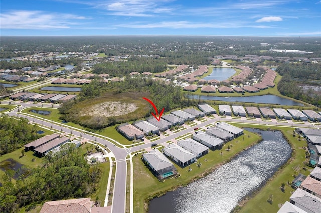 birds eye view of property with a water view