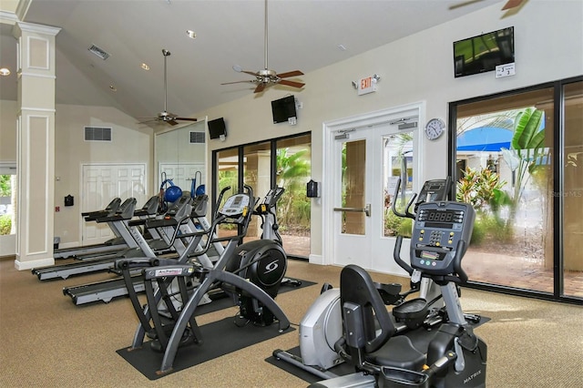 exercise room featuring high vaulted ceiling, carpet, ceiling fan, and ornate columns