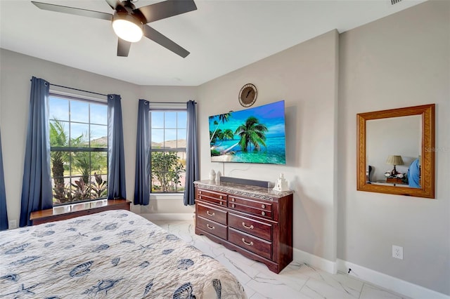 1337 Sorrell Way, North Port, FL 34289 - bedroom featuring baseboards, light marble finish flooring, and a ceiling fan