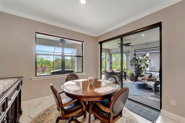 dining room featuring crown molding and ceiling fan