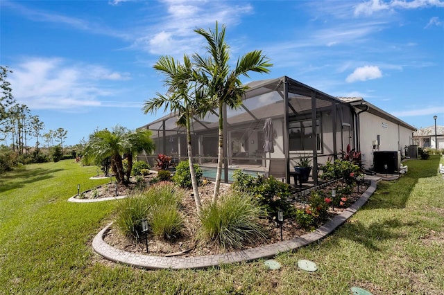 view of property exterior with cooling unit, a yard, and glass enclosure