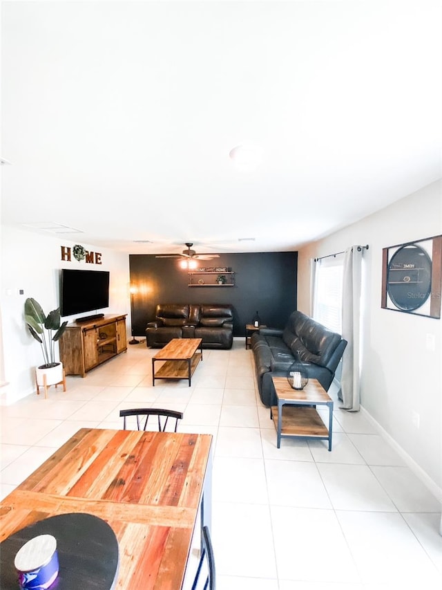 living room with light tile patterned floors and ceiling fan