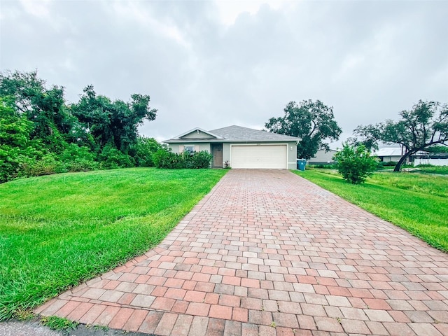 view of front facade with a front yard and a garage