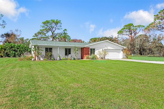 ranch-style house featuring a porch, a front lawn, and a garage