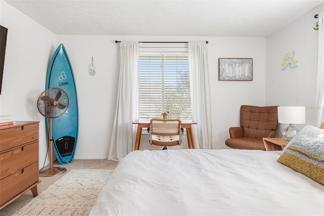 carpeted bedroom featuring a textured ceiling