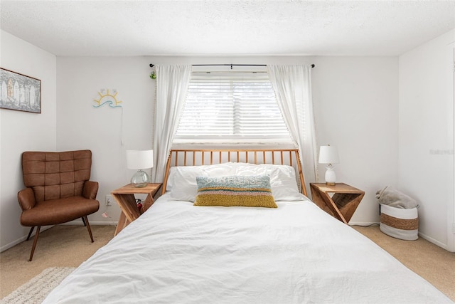 carpeted bedroom featuring a textured ceiling