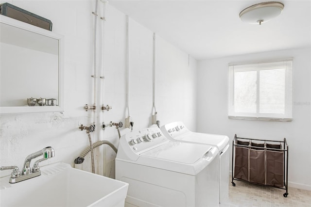 laundry area with washer and dryer and sink