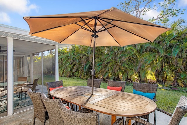 view of patio featuring a sunroom