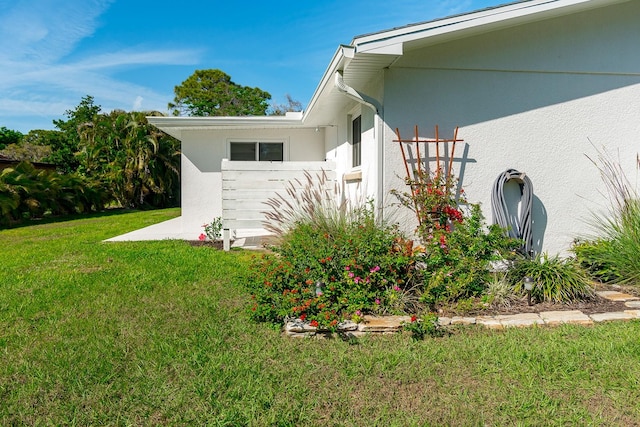 view of property exterior featuring a yard