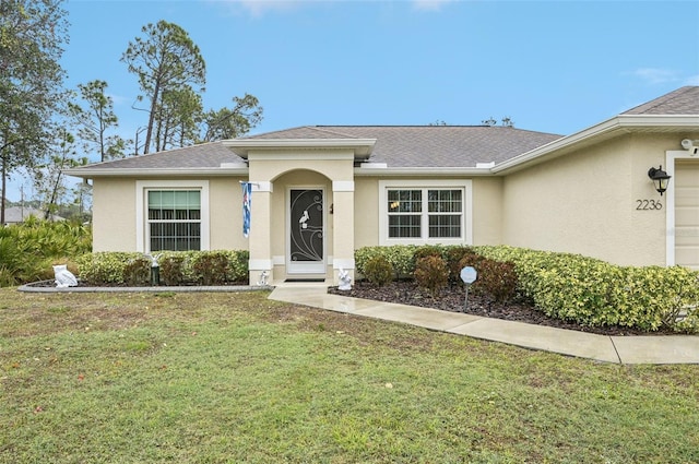 ranch-style home featuring a front lawn