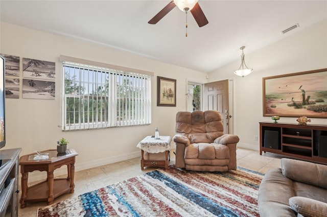 living room with lofted ceiling, light tile patterned floors, and ceiling fan