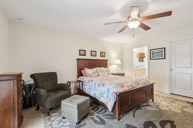 tiled bedroom featuring ceiling fan and ensuite bath