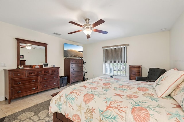 tiled bedroom with ceiling fan