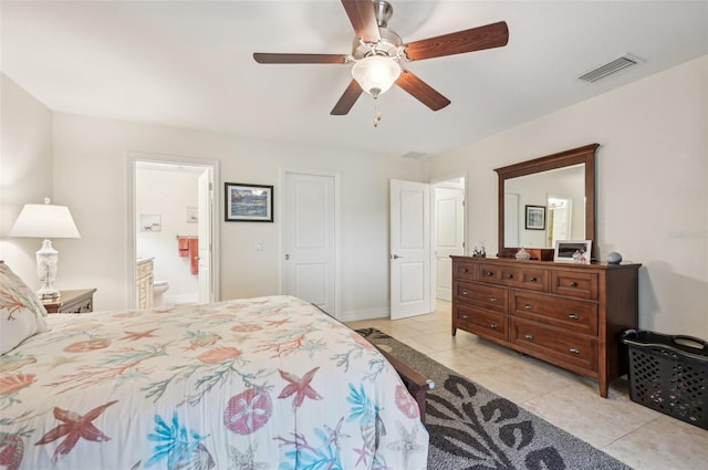 bedroom featuring light tile patterned flooring, ceiling fan, and ensuite bathroom